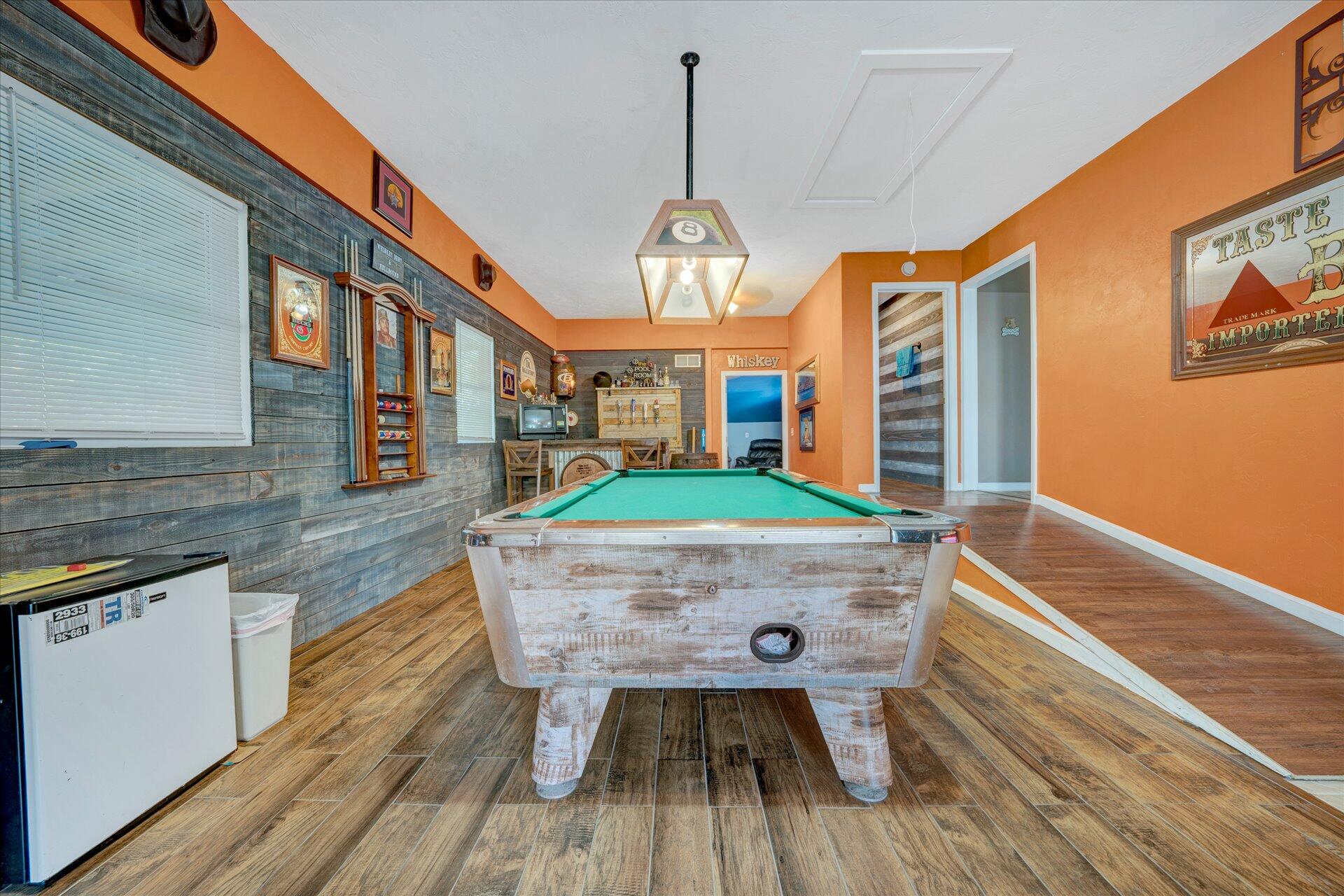 1041 Owen Ridge Lane Goodview, VA 24095 - Photo 30 of 58 a room with wooden floor pool table and chairs