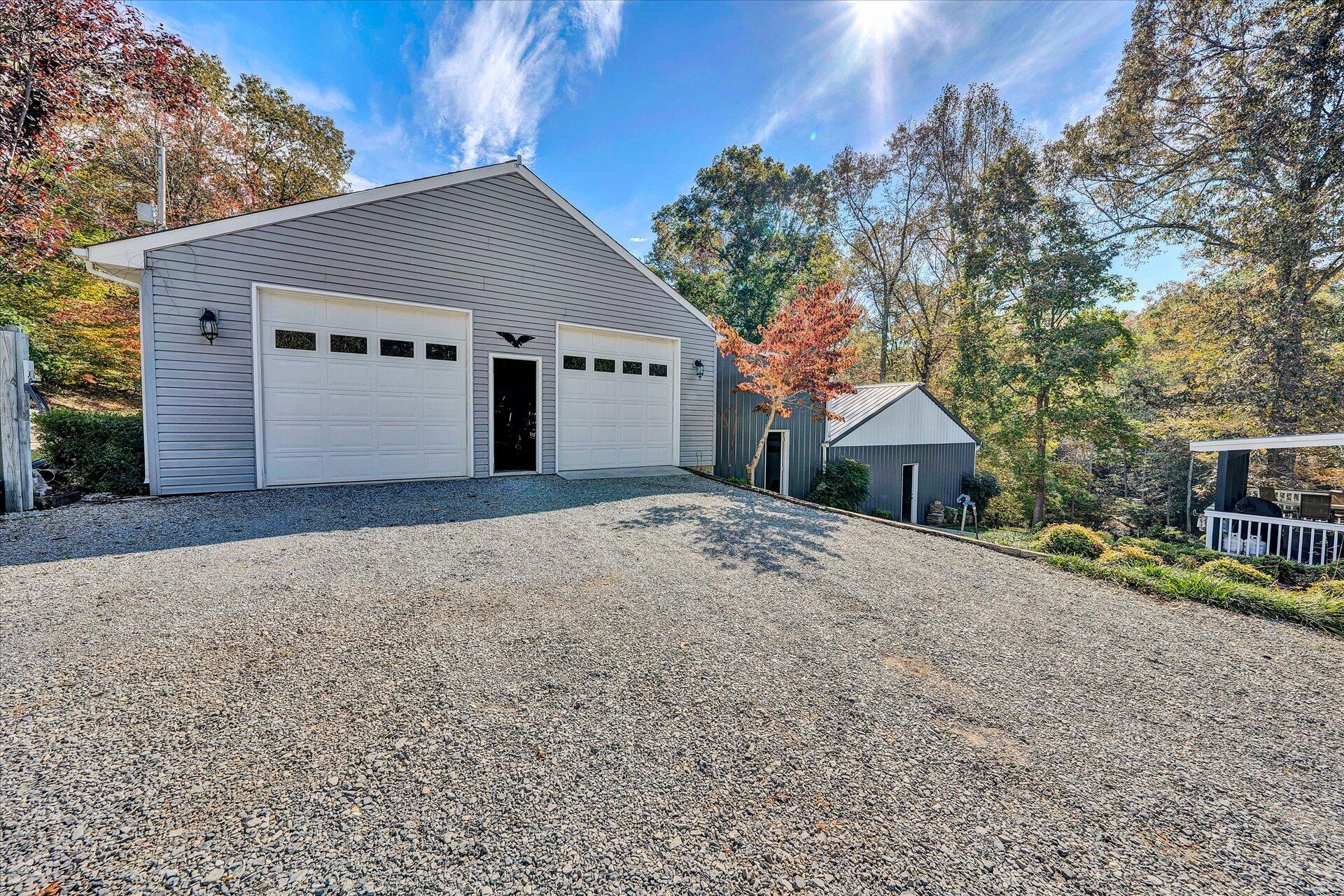 1041 Owen Ridge Lane Goodview, VA 24095 - Photo 45 of 58 a front view of house with yard and trees in the background