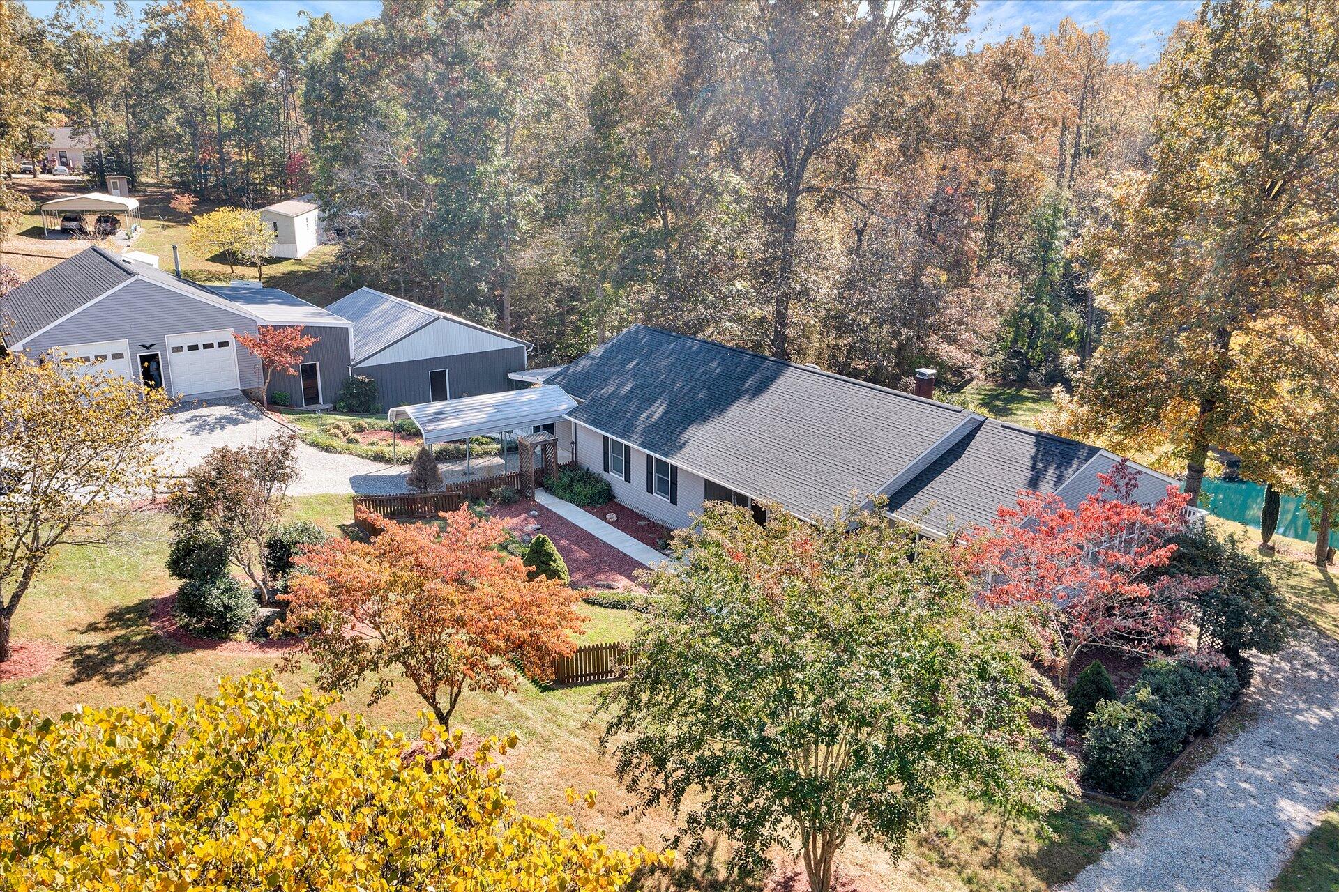 1041 Owen Ridge Lane Goodview, VA 24095 - Photo 48 of 58 a view of a house with a yard and sitting area