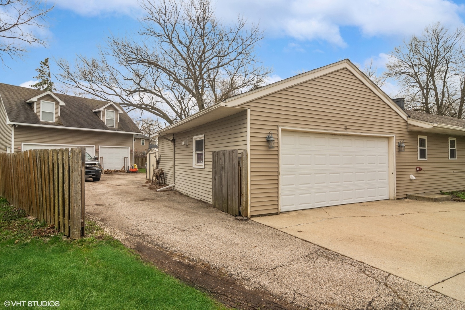11 Rugby Road Lake Zurich, IL 60047 - Photo 2 of 25 a view of a house with a backyard and garage
