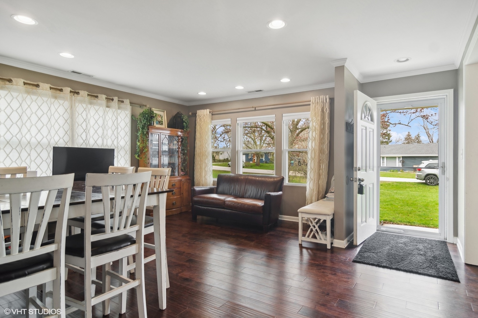11 Rugby Road Lake Zurich, IL 60047 - Photo 3 of 25 a living room with furniture a flat screen tv and a large window