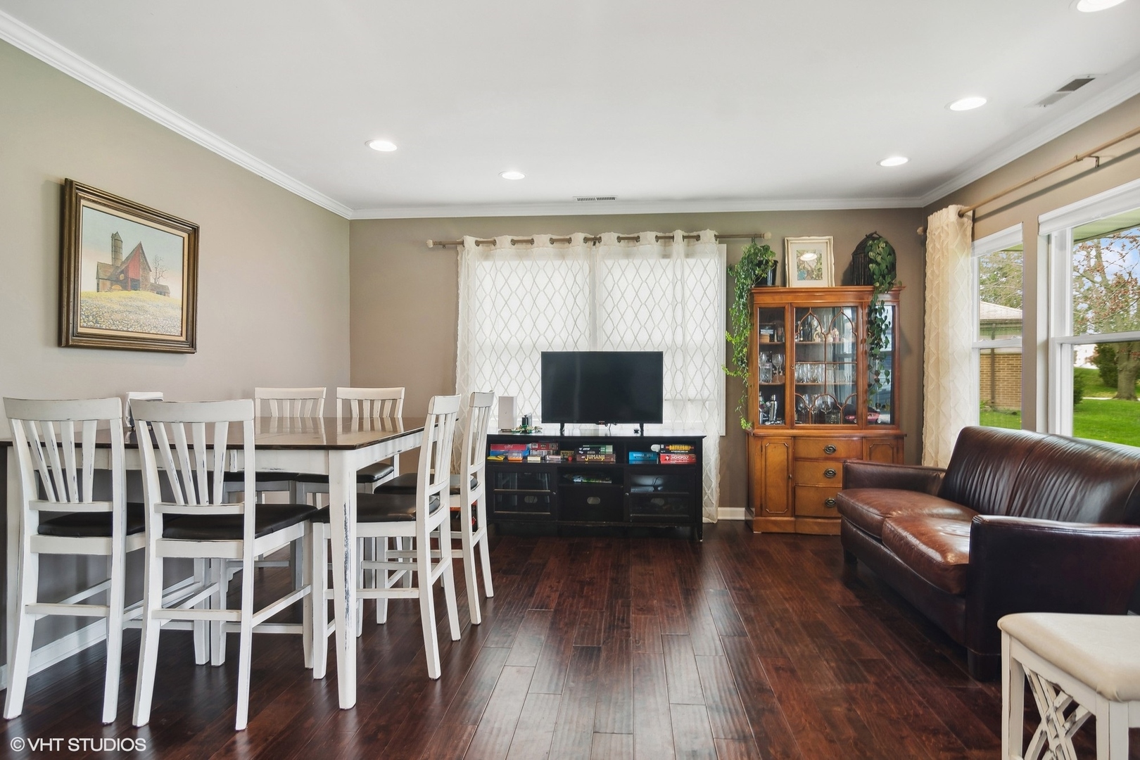 11 Rugby Road Lake Zurich, IL 60047 - Photo 6 of 25 a living room with furniture a flat screen tv and wooden floor