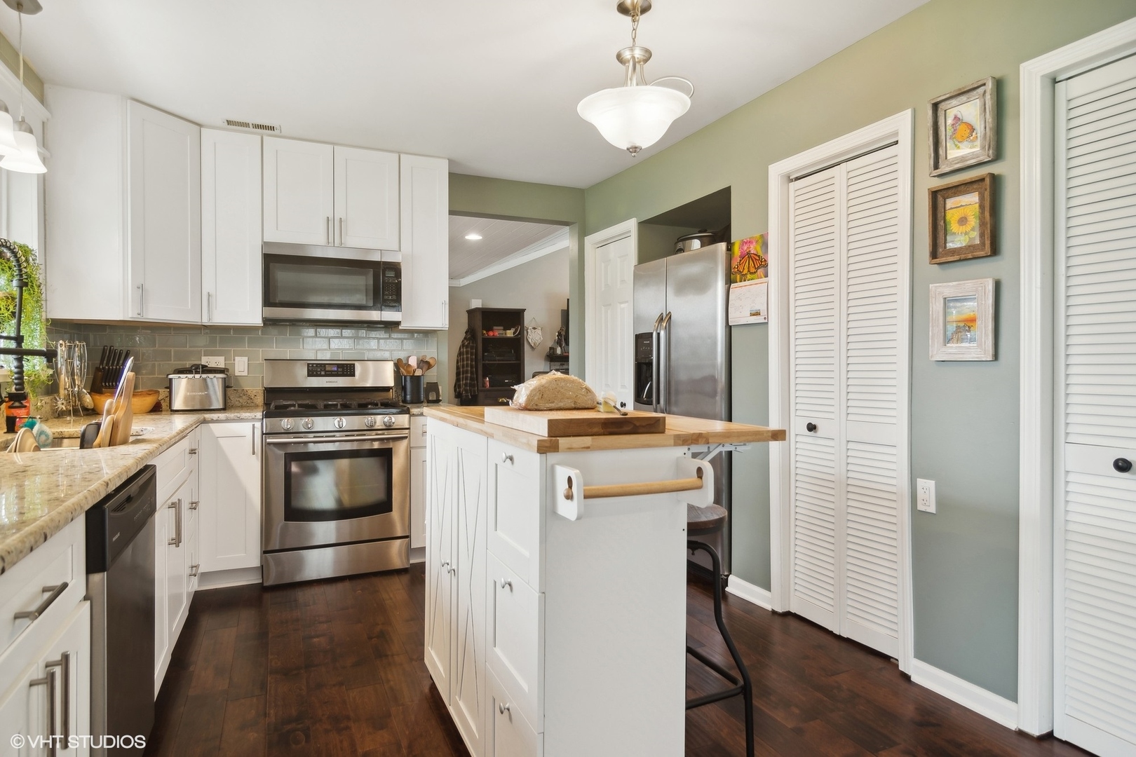11 Rugby Road Lake Zurich, IL 60047 - Photo 9 of 25 a kitchen with a sink a stove a refrigerator and cabinets