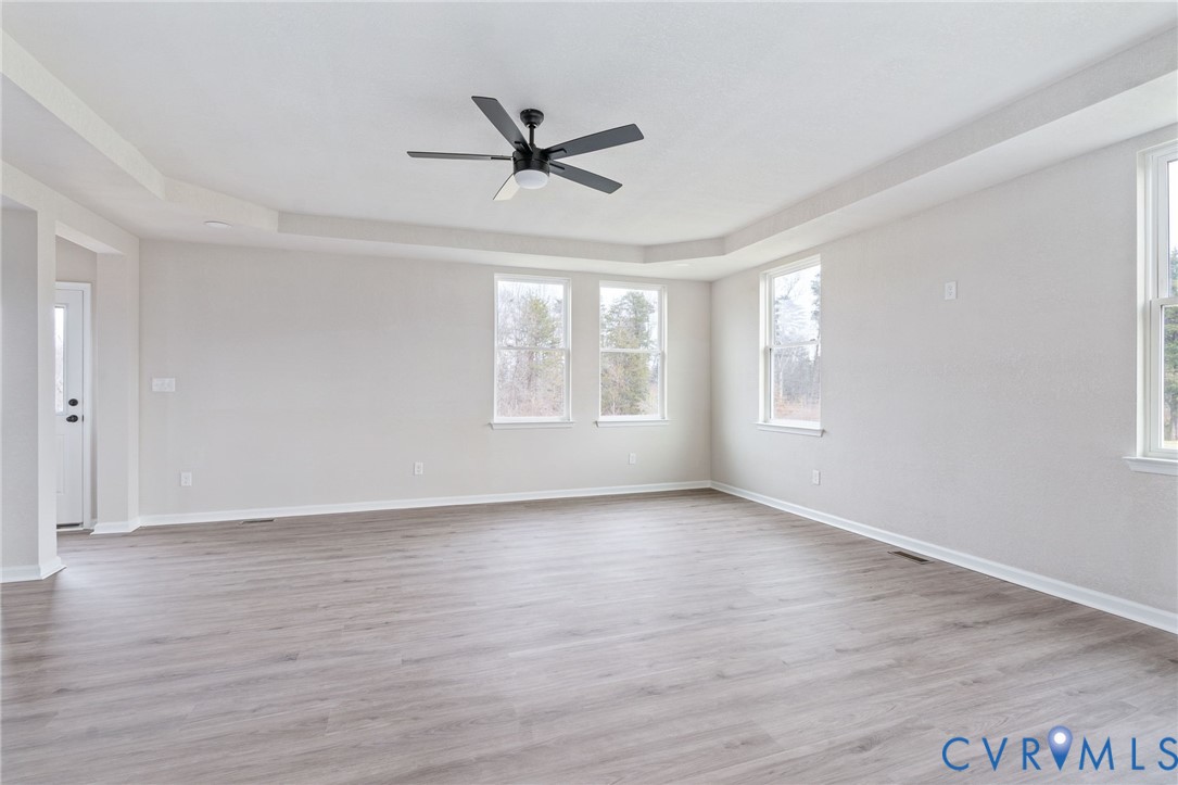 63 Hatcher Road Powhatan, VA 23139 - Photo 12 of 48 a view of empty room with wooden floor and fan