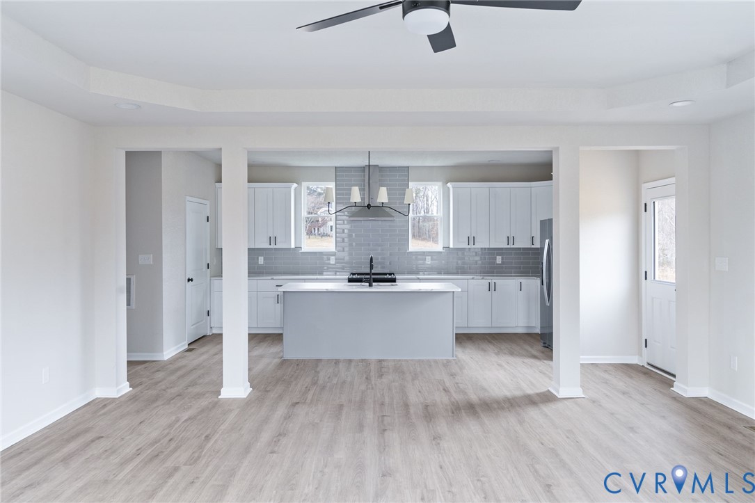 63 Hatcher Road Powhatan, VA 23139 - Photo 14 of 48 a large kitchen with a wooden floor and stainless steel appliances