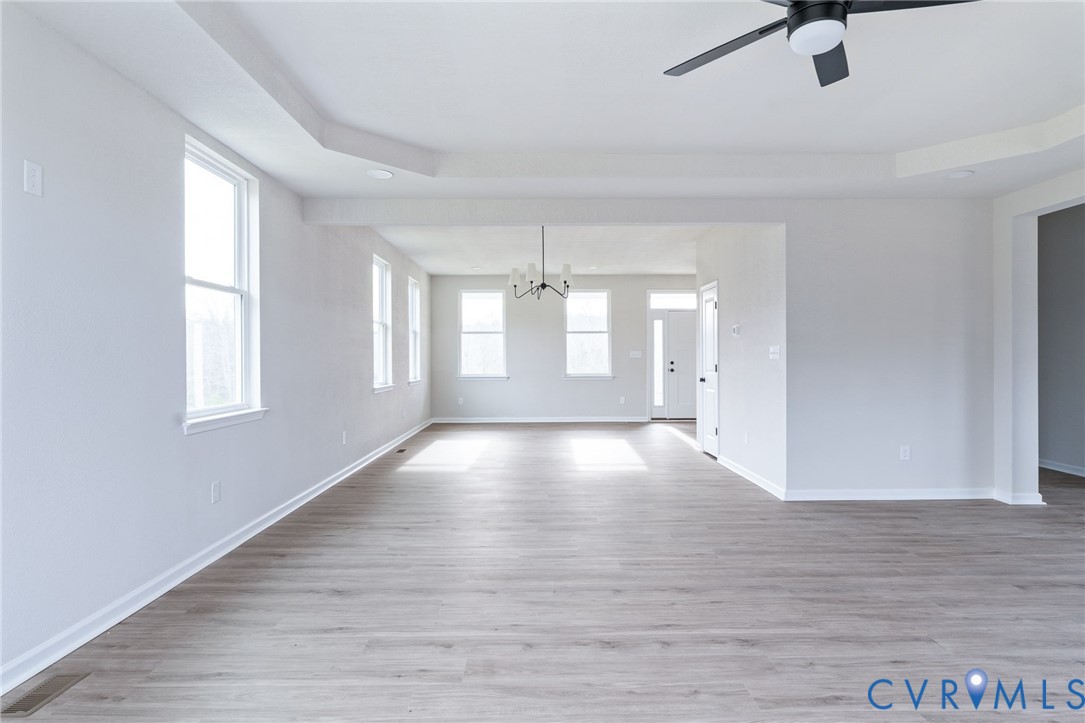 63 Hatcher Road Powhatan, VA 23139 - Photo 15 of 48 wooden floor in an empty room with a window