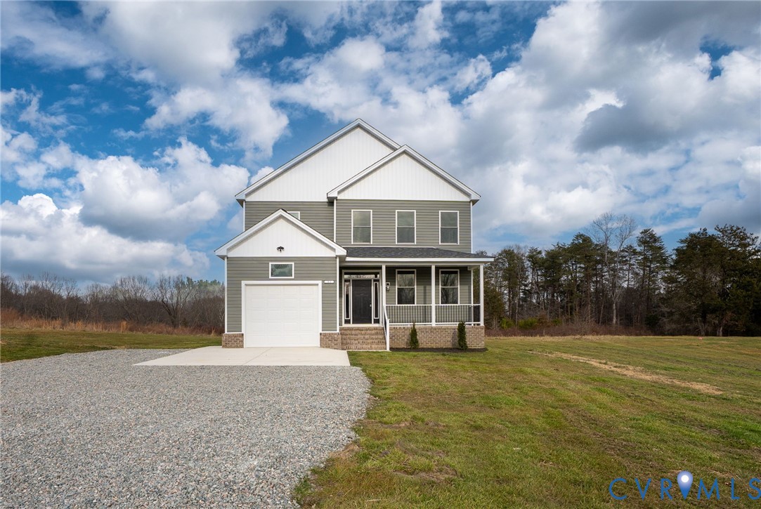 63 Hatcher Road Powhatan, VA 23139 - Photo 2 of 48 a view of a house with a yard and large trees