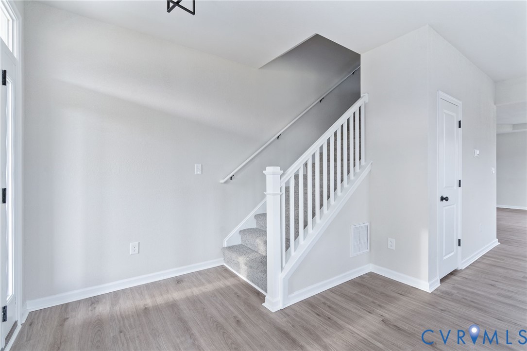 63 Hatcher Road Powhatan, VA 23139 - Photo 26 of 48 a view of a hallway with wooden floor and entryway