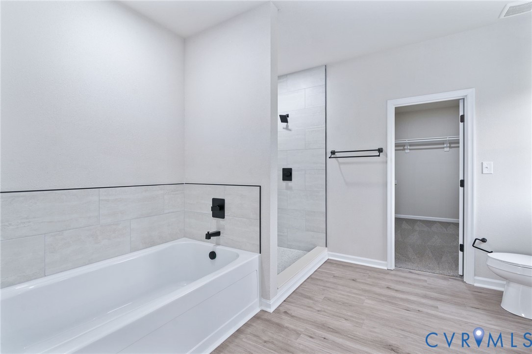 63 Hatcher Road Powhatan, VA 23139 - Photo 30 of 48 a bathroom with a bathtub and a toilet