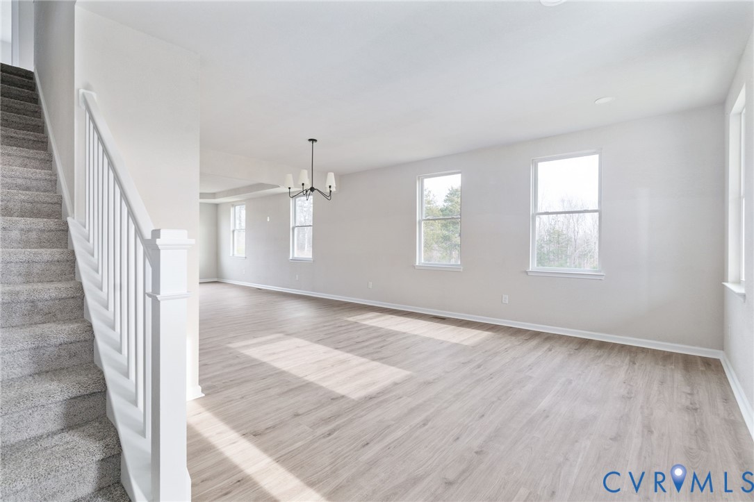 63 Hatcher Road Powhatan, VA 23139 - Photo 8 of 48 wooden floor in an empty room with a window