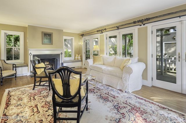a living room with furniture rug and window