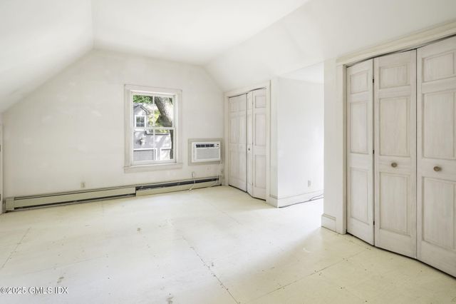 a view of empty room with windows