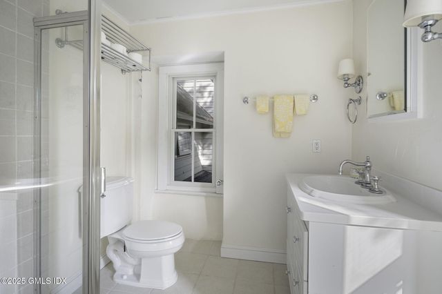 a view of a chairs and table in backyard