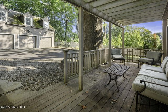 a view of an outdoor dining space with a table and chairs