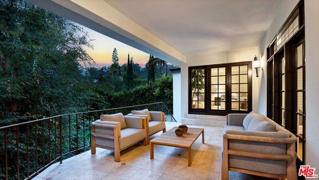 a outdoor living space with furniture and a potted plant