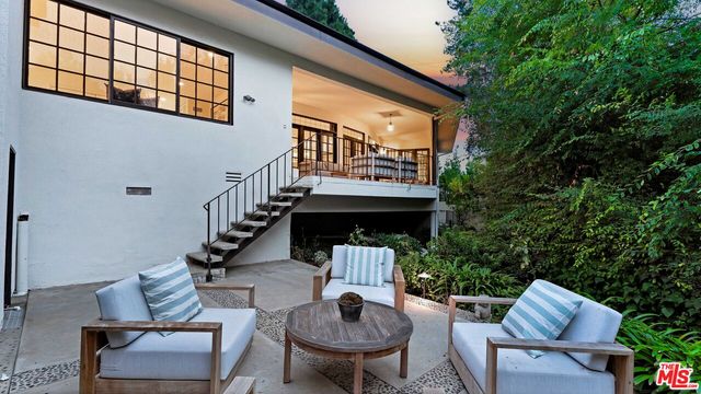 a view of balcony with furniture