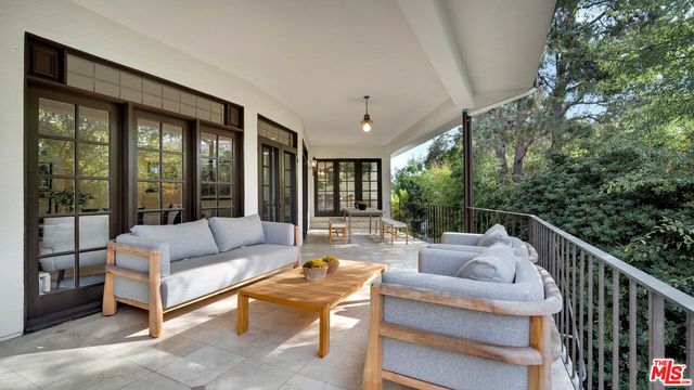 a outdoor living space with furniture and a potted plant