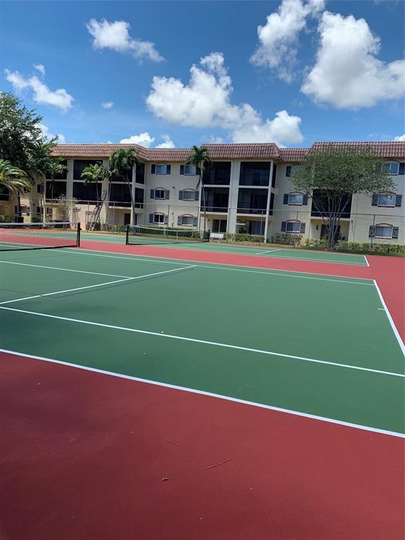 259 South Cypress Road, Unit 533 Pompano Beach, FL 33060 - Photo 16 of 19 a view of a tennis court