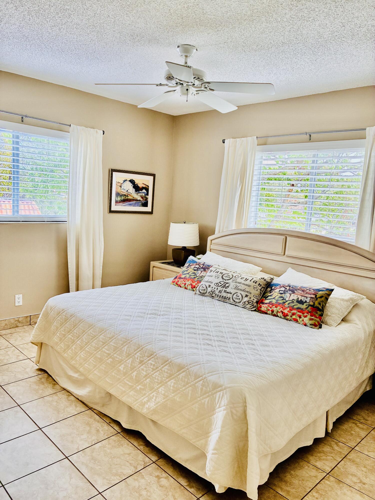 259 South Cypress Road, Unit 533 Pompano Beach, FL 33060 - Photo 2 of 19 a bedroom with a bed and a window