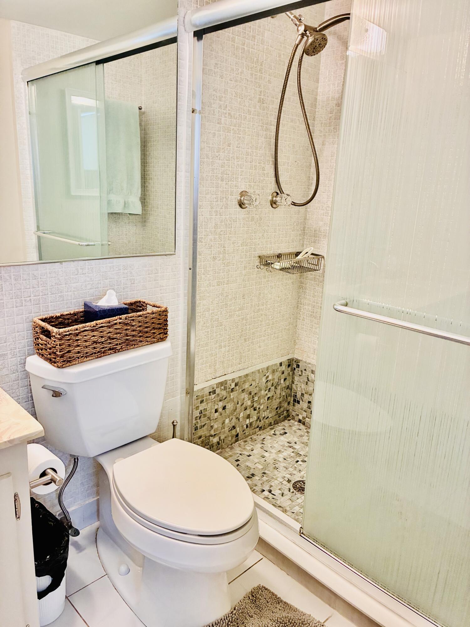 259 South Cypress Road, Unit 533 Pompano Beach, FL 33060 - Photo 6 of 19 a bathroom with a toilet and a shower