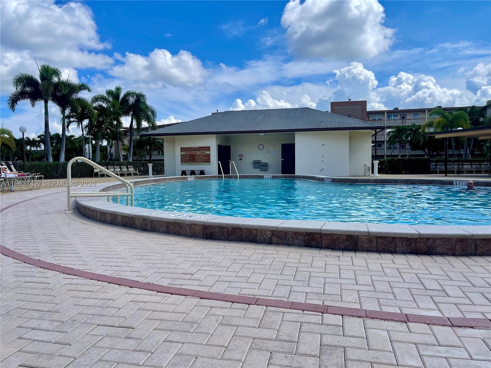 2042 Newcastle A, Unit 2042 Boca Raton, FL 33434 - Photo 15 of 17 a view of a house with a yard and potted plants