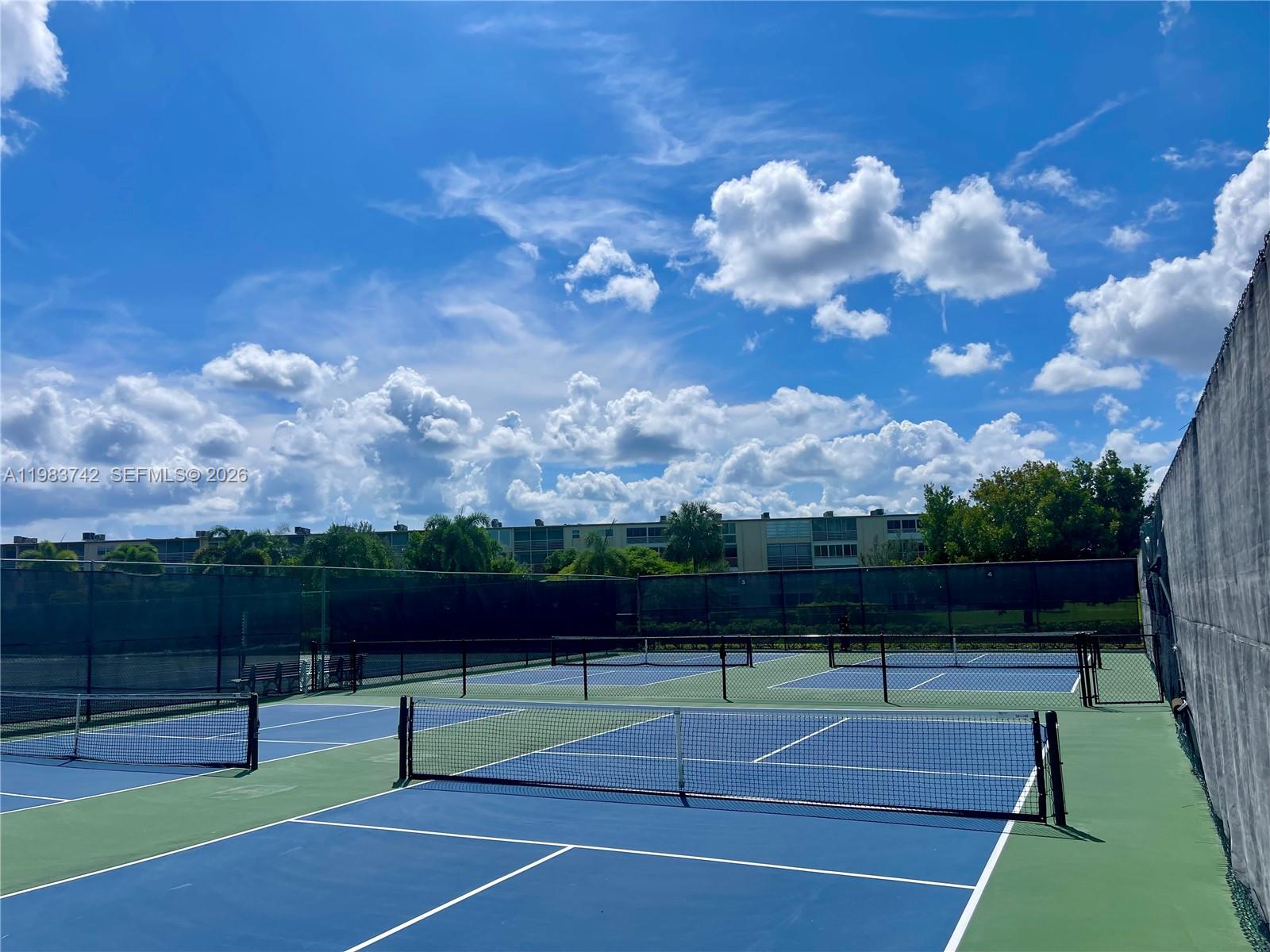 2042 Newcastle A, Unit 2042 Boca Raton, FL 33434 - Photo 17 of 17 a view of a tennis court
