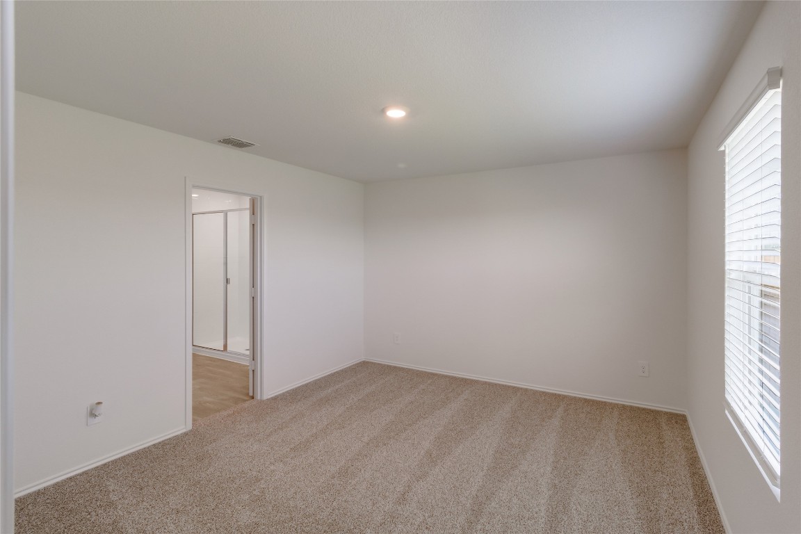 472 Sandringham Loop Kyle, TX 78640 - Photo 12 of 20 an empty room with a window