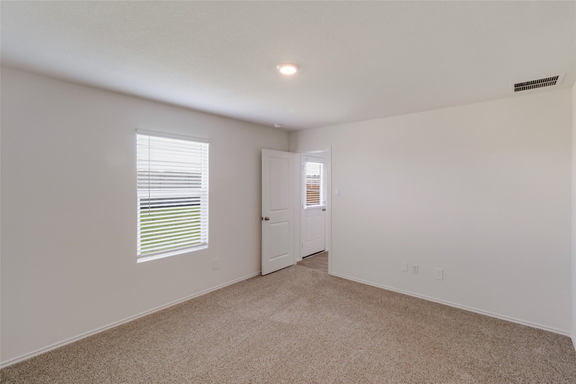 472 Sandringham Loop Kyle, TX 78640 - Photo 14 of 20 an empty room with windows