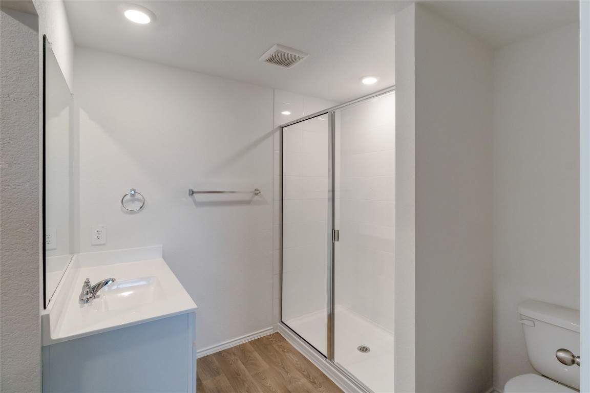 472 Sandringham Loop Kyle, TX 78640 - Photo 15 of 20 a bathroom with a sink a toilet and shower