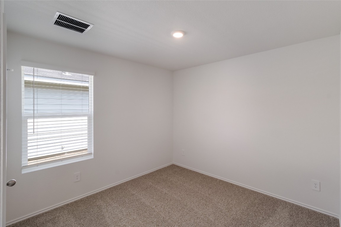 472 Sandringham Loop Kyle, TX 78640 - Photo 19 of 20 an empty room with a window