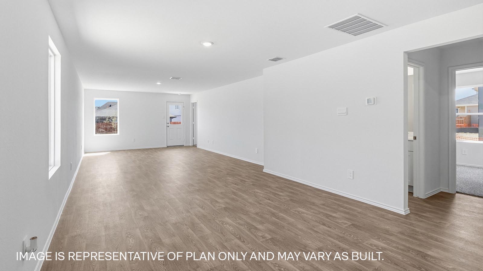 472 Sandringham Loop Kyle, TX 78640 - Photo 5 of 17 an empty room with wooden floor and windows