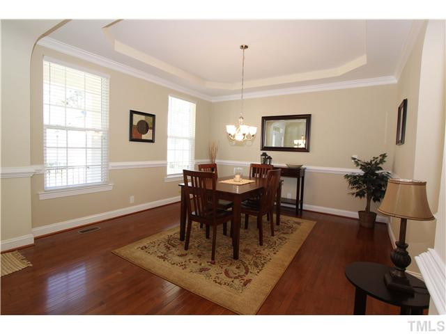 5807 Claribel Court Raleigh, NC 27612 - Photo 4 of 24 New chandelier replaces the select builder lighting Dining Room