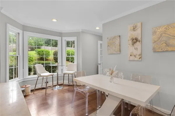 a view of a dining room with furniture window and outside view