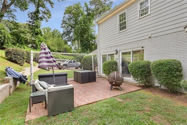 a house view with a sitting space and garden
