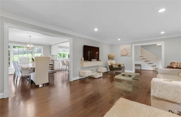 a living room with fireplace furniture and a flat screen tv