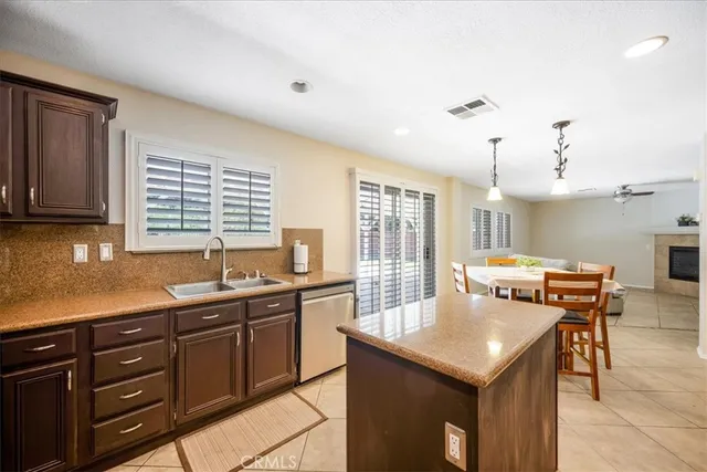 a kitchen with stainless steel appliances granite countertop a stove and a sink