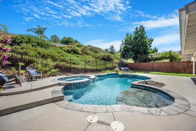 a view of a swimming pool with a patio