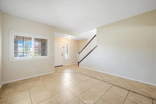 a view of an empty room with windows