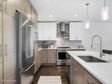 a kitchen with a sink stove and refrigerator