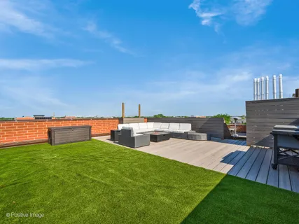a view of a house with patio and a yard