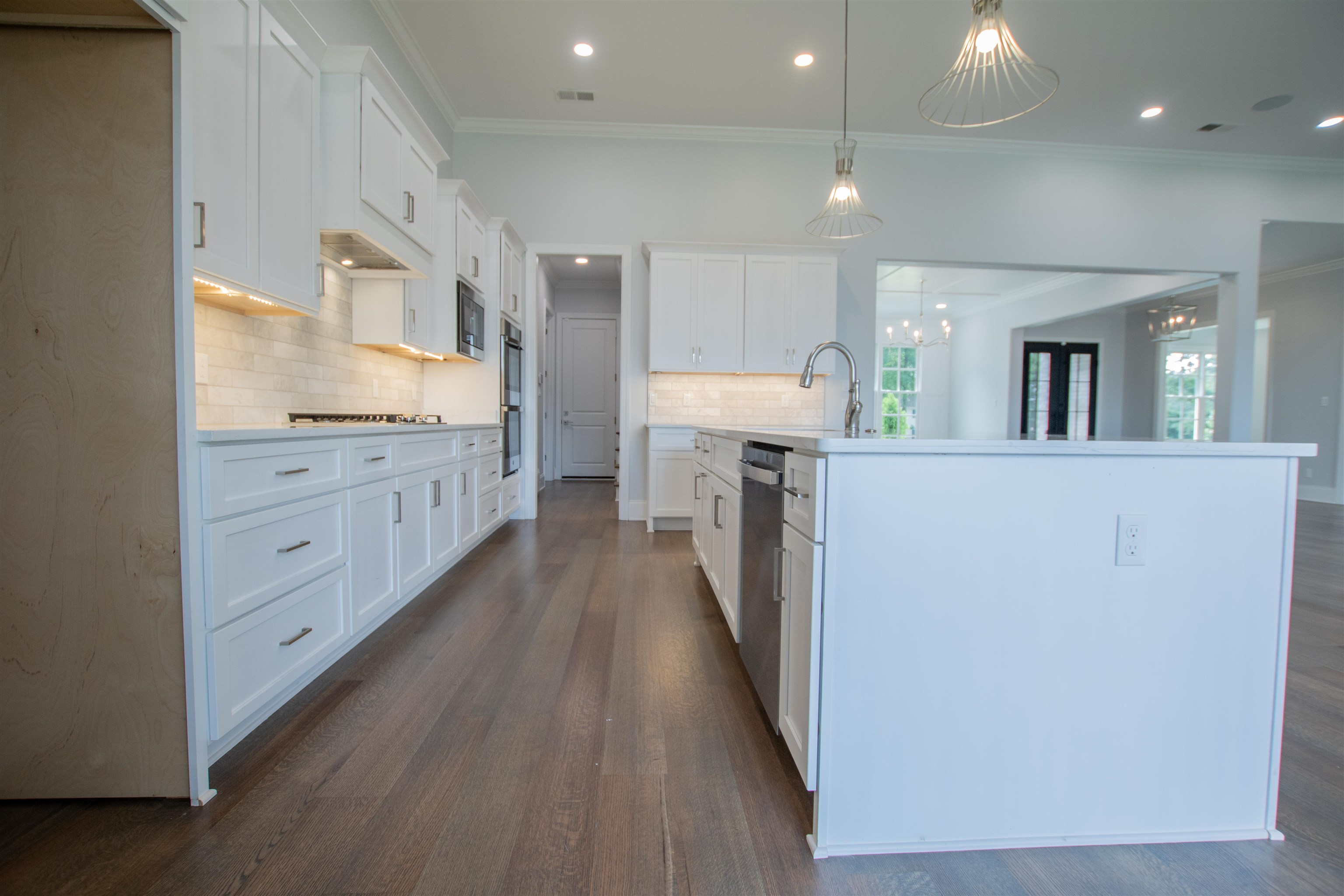 2611 Moore Road Germantown, TN 38138 - Photo 15 of 40 a kitchen with cabinets and wooden floor