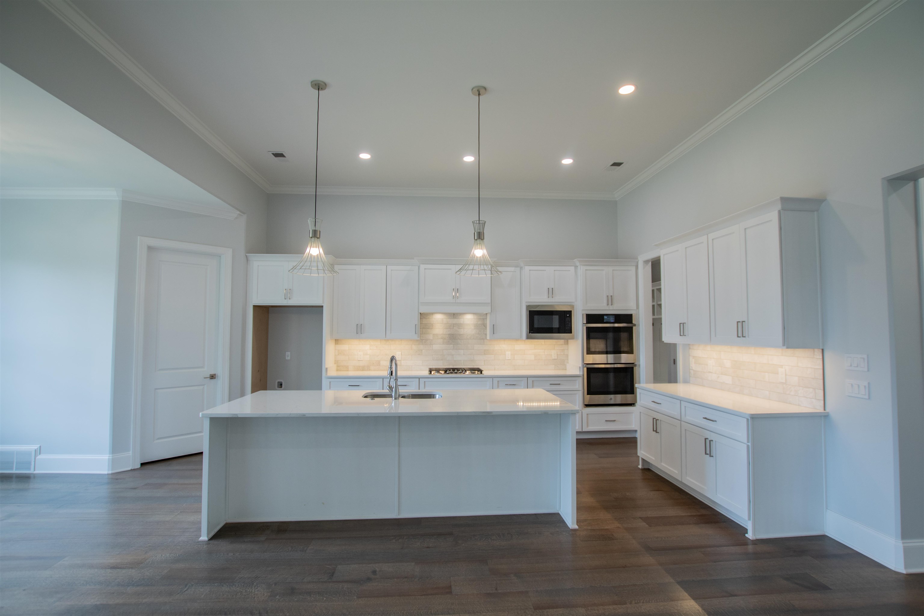 2611 Moore Road Germantown, TN 38138 - Photo 16 of 40 a large kitchen with kitchen island a sink stainless steel appliances and cabinets