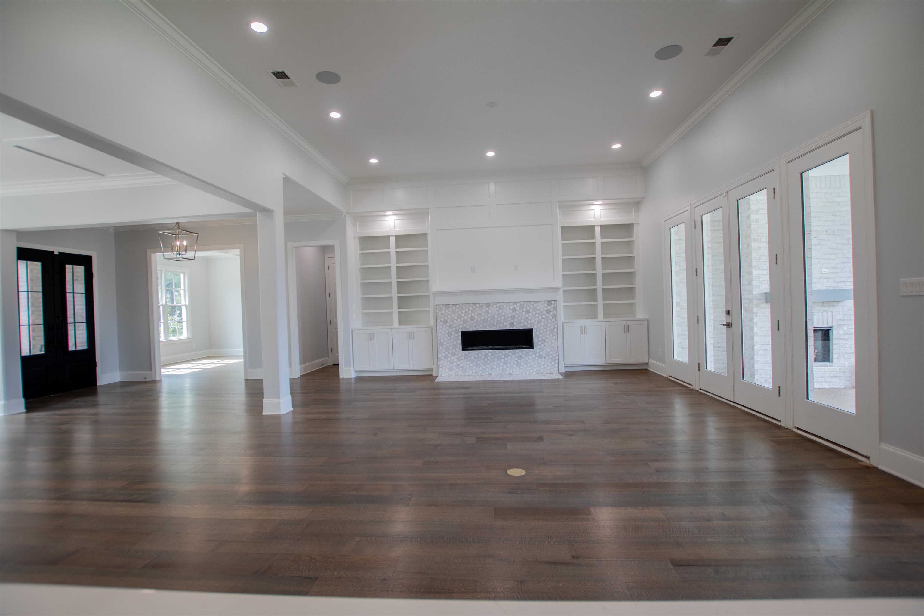 2611 Moore Road Germantown, TN 38138 - Photo 21 of 40 a view of empty room with wooden floor and fireplace