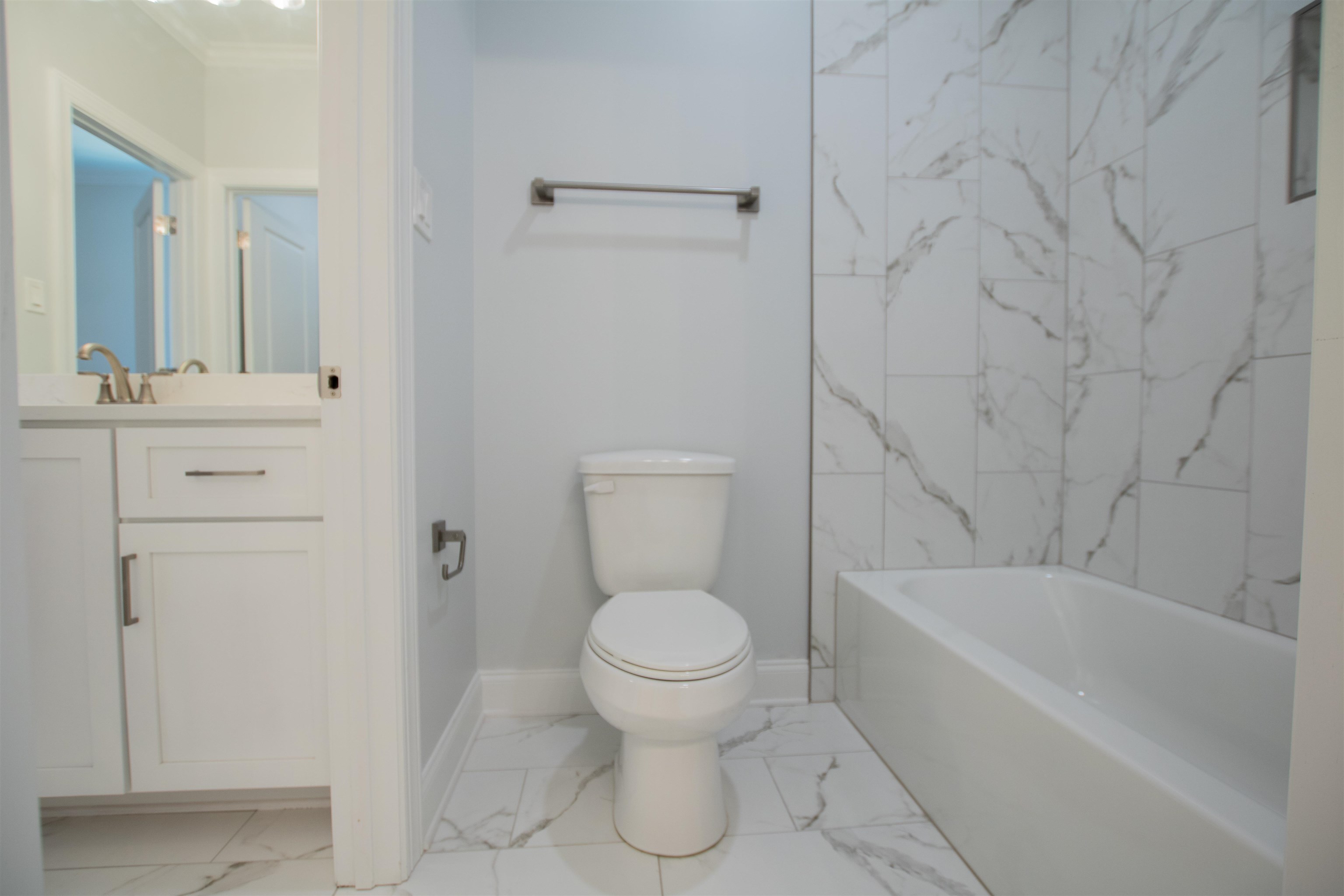 2611 Moore Road Germantown, TN 38138 - Photo 35 of 40 a bathroom with a toilet and a bathtub