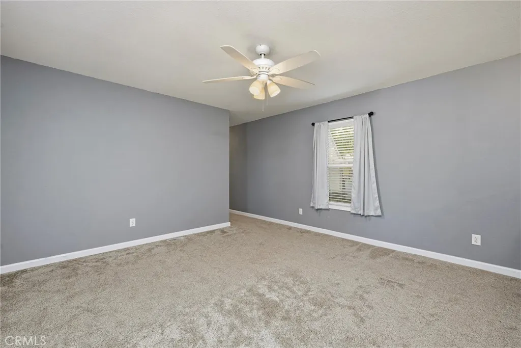 375 East State 20 Upper Lake, CA 95485 - Photo 8 of 24 an empty room with a window and a fan