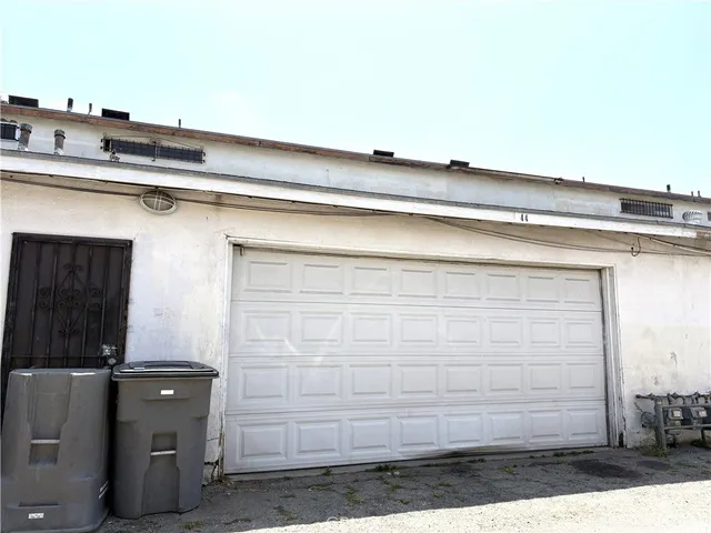 a view of a door with a white door and wooden floor
