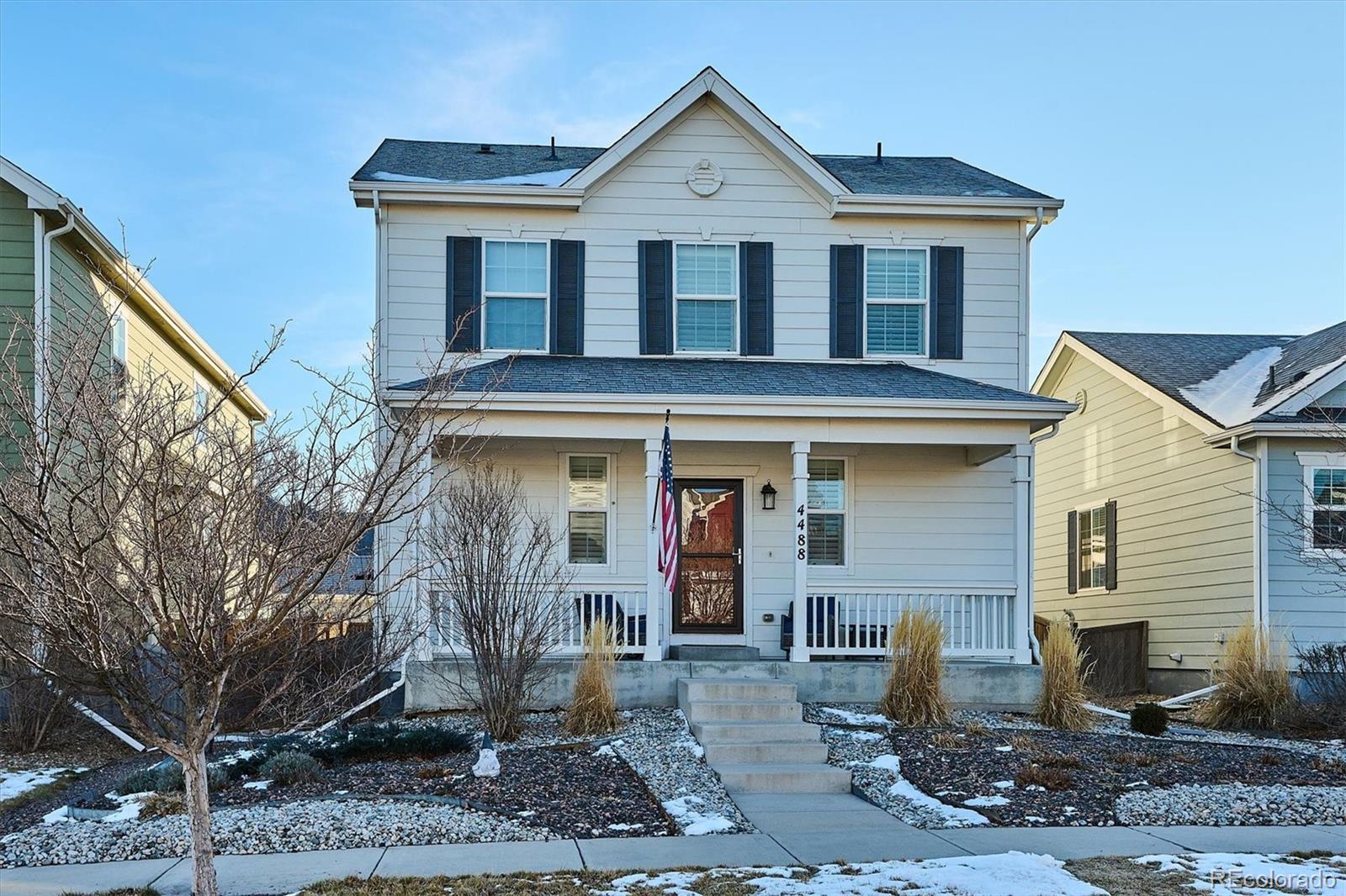 4488 Grapevine Way Castle Rock, CO 80109 - Photo 1 of 46 a front view of a house with garden
