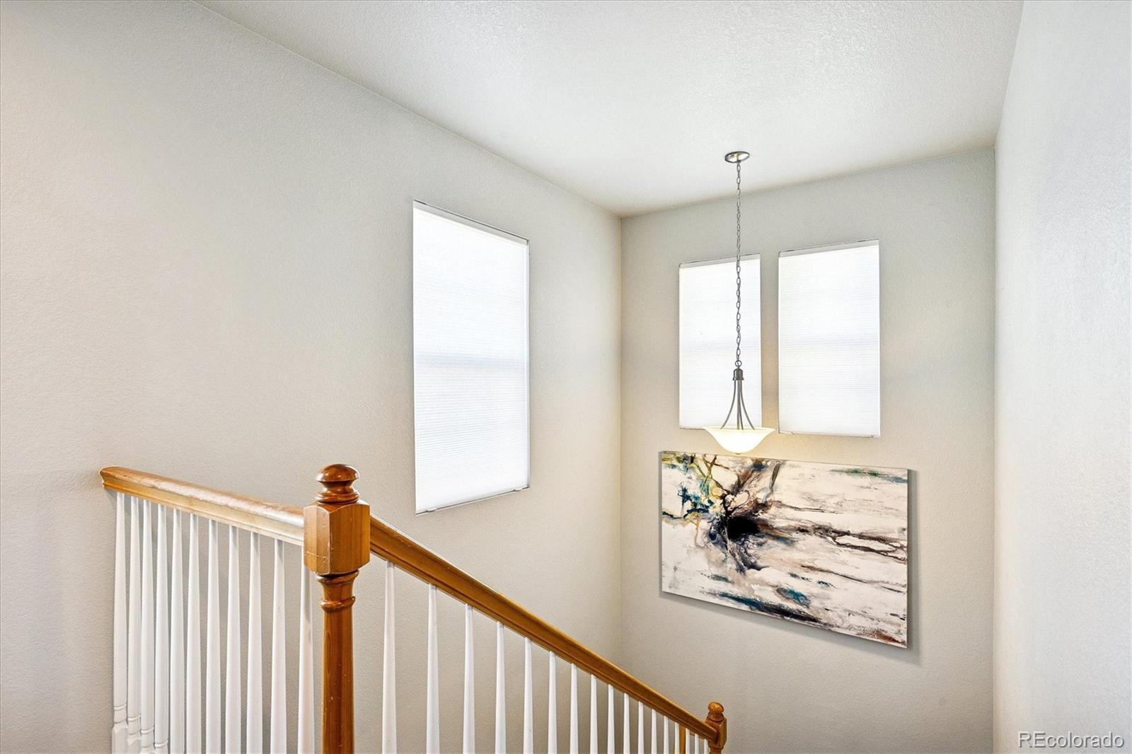 4488 Grapevine Way Castle Rock, CO 80109 - Photo 17 of 46 a view of a hallway with windows