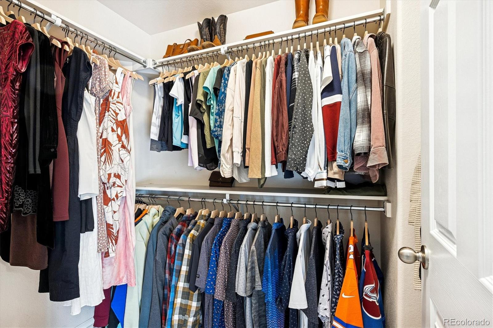 4488 Grapevine Way Castle Rock, CO 80109 - Photo 22 of 46 a view of walk in closet with clothes