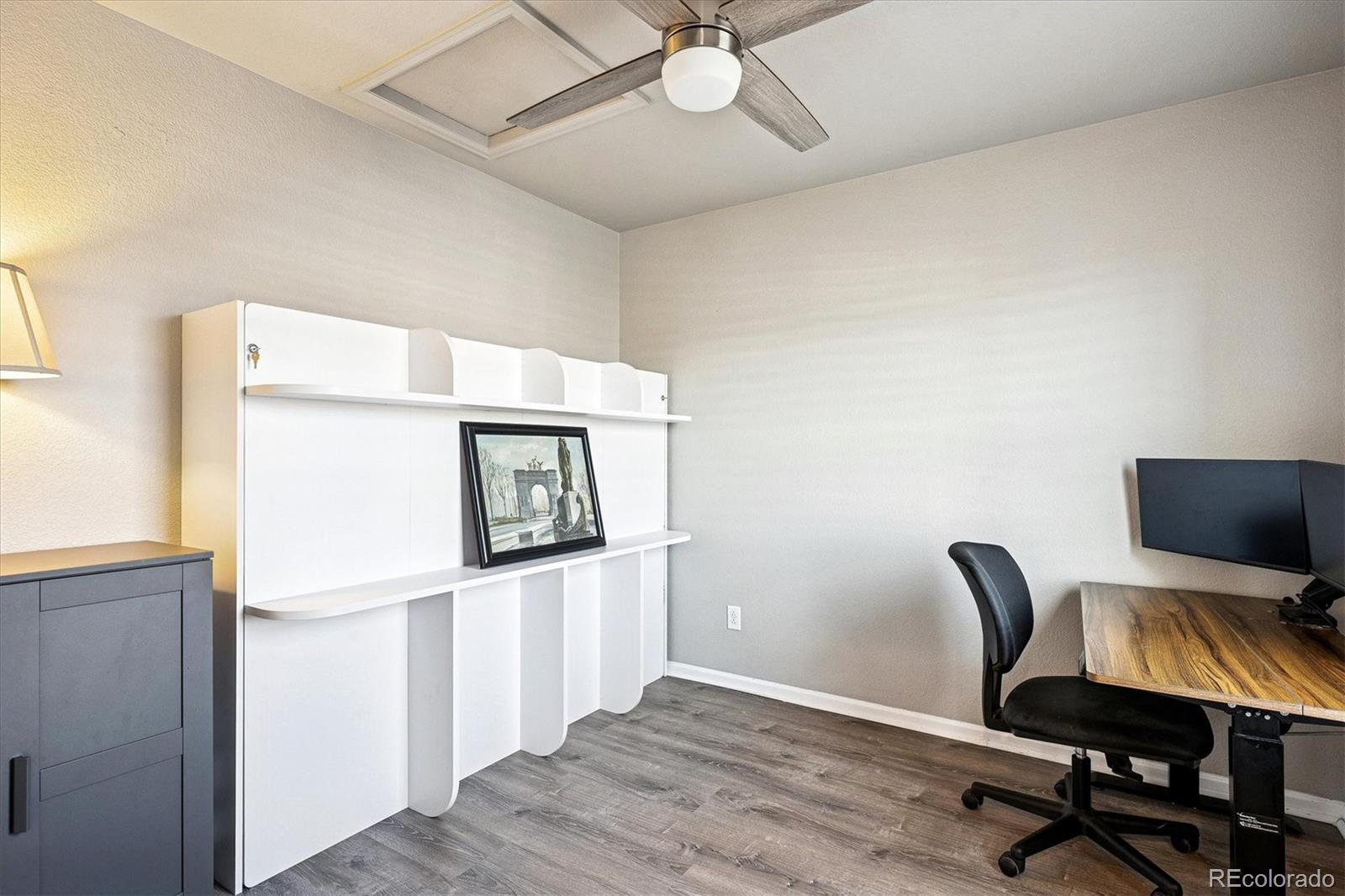 4488 Grapevine Way Castle Rock, CO 80109 - Photo 24 of 46 a workspace with furniture and wooden floor